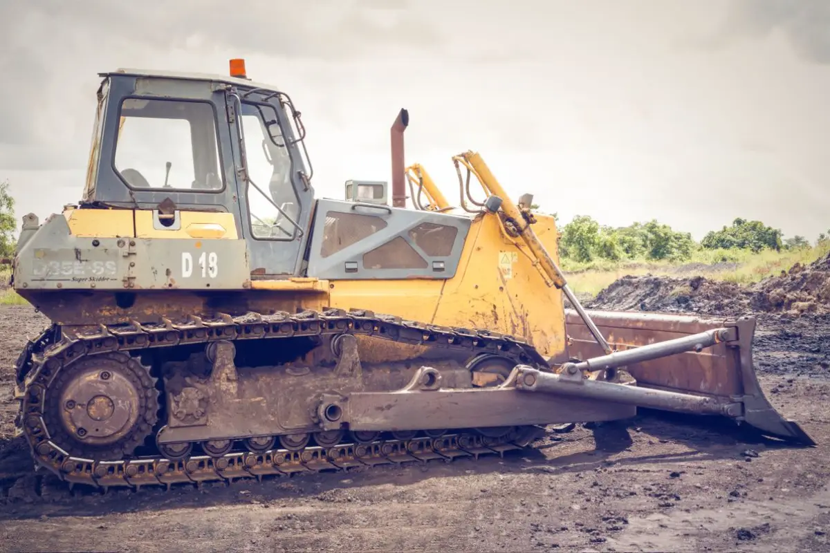 A crawler dozer standing on freshly graded soil