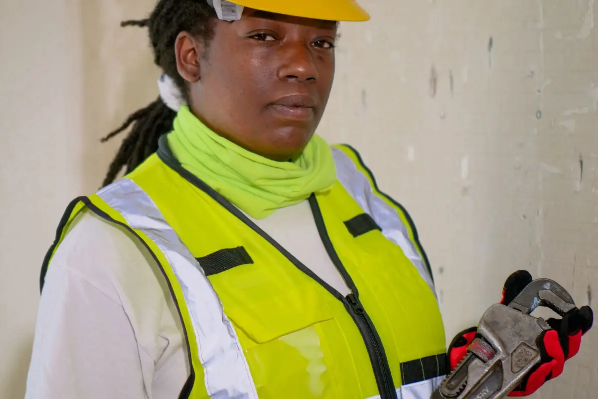 A worker in a high visibility vest